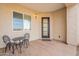 Charming entryway featuring wood-look tile flooring and an outdoor seating area at 11416 S 208Th Ave, Buckeye, AZ 85326