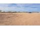 Photo shows vacant lot with a white fence at 11416 S 208Th Ave, Buckeye, AZ 85326