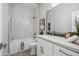Elegant bathroom featuring a marble-tiled shower, modern vanity, and stylish fixtures at 11537 W Laurelwood Ln, Avondale, AZ 85392