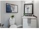 Stylish bathroom featuring a modern vanity, framed mirror, and decorative accents at 11537 W Laurelwood Ln, Avondale, AZ 85392