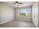 Spacious bedroom with a window view and a ceiling fan at 11537 W Laurelwood Ln, Avondale, AZ 85392