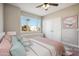 Bedroom with a bed, pillows, and a window at 11537 W Laurelwood Ln, Avondale, AZ 85392