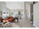 Open floor plan with a well-lit living area, kitchen with bar seating, and stylish furnishings at 11537 W Laurelwood Ln, Avondale, AZ 85392