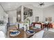 Open-concept living area showcases a modern kitchen, dining table, and living room with high ceilings at 11537 W Laurelwood Ln, Avondale, AZ 85392