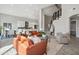 Spacious living area with comfortable seating, a modern kitchen in the background, and a staircase at 11537 W Laurelwood Ln, Avondale, AZ 85392