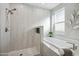 Luxurious bathroom showcasing a soaking tub, rainfall shower, and modern fixtures and hardware at 11537 W Laurelwood Ln, Avondale, AZ 85392