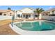 Backyard pool with a basketball hoop and ample space for outdoor activities at 11537 W Laurelwood Ln, Avondale, AZ 85392