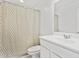Well-lit bathroom with a patterned shower curtain and a minimalist sink design at 12089 E Sunflower Ln, Florence, AZ 85132