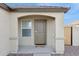 Close-up of the home's front entrance, featuring a covered porch and desert landscaping at 12089 E Sunflower Ln, Florence, AZ 85132