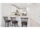 Bright kitchen with stainless steel appliances, ample counter space and modern seating at 12089 E Sunflower Ln, Florence, AZ 85132