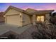 Front exterior shows a stucco house with tile roof and a 2-car garage at 13230 W Acapulco Ln, Surprise, AZ 85379