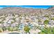Picturesque neighborhood featuring beautiful homes, lush greenery, and desert mountain backdrop at 1349 E Rock Wren Rd, Phoenix, AZ 85048