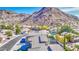 Charming neighborhood displaying attractive houses, green foliage, and the majestic mountain range at 1349 E Rock Wren Rd, Phoenix, AZ 85048