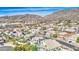 Suburban aerial view of a well-maintained neighborhood with lush landscaping and beautiful mountain views at 1349 E Rock Wren Rd, Phoenix, AZ 85048