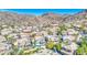 An aerial view of a vibrant community, showcasing lush landscaping, and beautiful mountain views at 1349 E Rock Wren Rd, Phoenix, AZ 85048