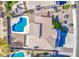 Aerial view of the property showing the swimming pool, patio, and tile roof at 1349 E Rock Wren Rd, Phoenix, AZ 85048