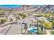 Gorgeous aerial view of a desert community featuring lush landscaping, pools, and mountain views at 1349 E Rock Wren Rd, Phoenix, AZ 85048