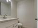 Powder room featuring white vanity, modern faucet, and neutral paint at 1349 E Rock Wren Rd, Phoenix, AZ 85048