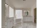 Elegant bathroom featuring a soaking tub, dual vanities, and a stylish glass block window at 1349 E Rock Wren Rd, Phoenix, AZ 85048