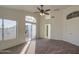 This spacious bedroom offers ample natural light, a ceiling fan, and access to a private balcony at 1349 E Rock Wren Rd, Phoenix, AZ 85048