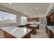 Modern kitchen with wood cabinets, quartz countertops and stainless steel appliances at 1349 E Rock Wren Rd, Phoenix, AZ 85048