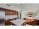 Spacious kitchen with center islands, wood cabinets, and stainless steel appliances at 1349 E Rock Wren Rd, Phoenix, AZ 85048