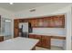 Modern kitchen with wood cabinets, quartz countertops and stainless steel appliances at 1349 E Rock Wren Rd, Phoenix, AZ 85048