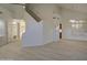 Spacious living room featuring high ceilings, wood-look tile floors and neutral walls at 1349 E Rock Wren Rd, Phoenix, AZ 85048