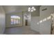 Bright living room featuring high ceilings, wood-look tile floors and large windows at 1349 E Rock Wren Rd, Phoenix, AZ 85048