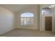 Bright living room featuring high ceilings, wood-look tile floors and large windows at 1349 E Rock Wren Rd, Phoenix, AZ 85048