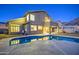 Backyard showcasing a private swimming pool and patio, perfect for entertaining with desert views at dusk at 1349 E Rock Wren Rd, Phoenix, AZ 85048