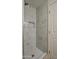 Modern bathroom shower features beautiful marble-look tile and a convenient built-in niche at 1349 E Rock Wren Rd, Phoenix, AZ 85048