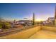 Expansive balcony view overlooking a residential neighborhood with desert mountain views and a colorful sunset at 1349 E Rock Wren Rd, Phoenix, AZ 85048