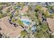 Scenic aerial view of the community's pool and recreation areas with mature trees at 1351 N Pleasant Dr # 1031, Chandler, AZ 85225