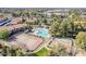 A beautiful aerial view of the community pool, clubhouse, and tennis courts at 1351 N Pleasant Dr # 1031, Chandler, AZ 85225