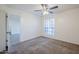 Bedroom with ceiling fan, neutral carpet, wainscotting and window offering natural light at 1351 N Pleasant Dr # 1031, Chandler, AZ 85225