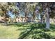 Exterior view of the property's well-maintained green spaces and mature trees at 1351 N Pleasant Dr # 1031, Chandler, AZ 85225