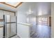 Bright living room features a stainless steel refrigerator, gray flooring, and access to an outdoor patio at 1351 N Pleasant Dr # 1031, Chandler, AZ 85225