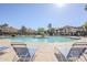 Community pool and sundeck with lounge chairs, perfect for relaxation and leisure at 1351 N Pleasant Dr # 1031, Chandler, AZ 85225