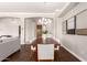 Bright dining room with a modern light fixture, wood table and seating for six at 1357 E Loma Vista St, Gilbert, AZ 85295