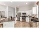 Kitchen with stainless steel appliances, granite countertops, mosaic backsplash and white cabinets at 1357 E Loma Vista St, Gilbert, AZ 85295