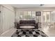 Comfortable living area with tile flooring, neutral paint, and plantation shutters at 14917 W Yosemite Dr, Sun City West, AZ 85375