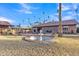 Lush backyard featuring a water fountain and swaying palm trees at 20 W Pasadena Ave, Phoenix, AZ 85013