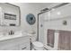 Modern bathroom featuring a glass-enclosed shower and vanity at 20 W Pasadena Ave, Phoenix, AZ 85013