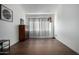 Inviting room with wood floors, modern lighting fixture, and bright natural light at 2040 S Longmore -- # 5, Mesa, AZ 85202