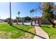Community pool area that is fenced in and has a paved walkway leading to the entrance at 2040 S Longmore -- # 5, Mesa, AZ 85202
