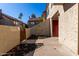 Townhouse entrance with a private patio area featuring drought-tolerant landscaping at 2040 S Longmore -- # 5, Mesa, AZ 85202