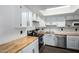 Bright kitchen featuring white cabinets, butcher block countertops, and stainless steel appliances at 2040 S Longmore -- # 5, Mesa, AZ 85202