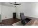 This room offers a ceiling fan and a spacious work area, perfect for a home office at 2040 S Longmore -- # 5, Mesa, AZ 85202