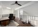 Upstairs office space featuring hardwood floors, lots of light, and a functional desk and chair at 2040 S Longmore -- # 5, Mesa, AZ 85202